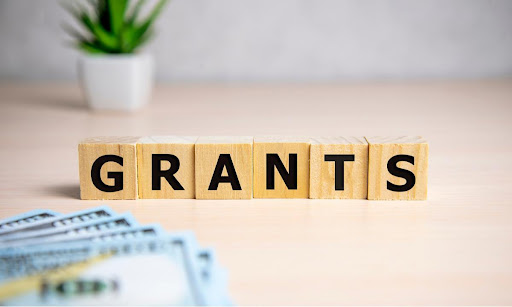 wood blocks that spell out the word "grants"